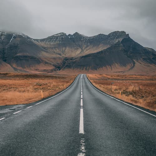 an image of a highway going out into the empty iceland
